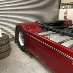 Body of a resprayed red lorry